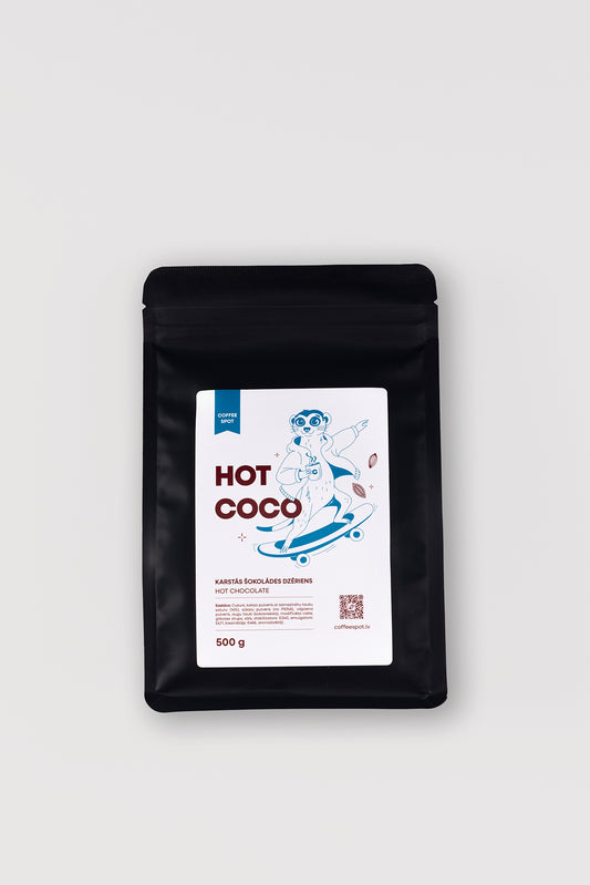 A 500g black stand-up pouch of Hot Coco coffee beans with a white label featuring a cartoon character and blue text, set against a light gray background.